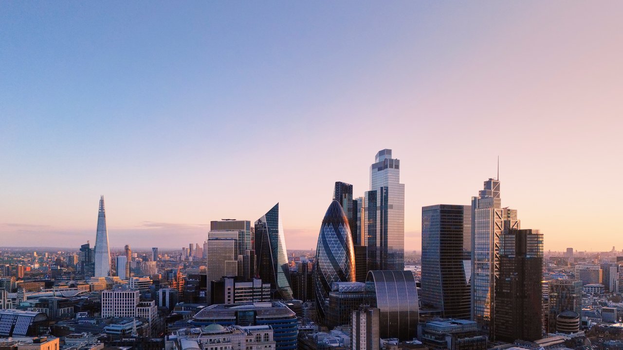View over city skyline at sunset