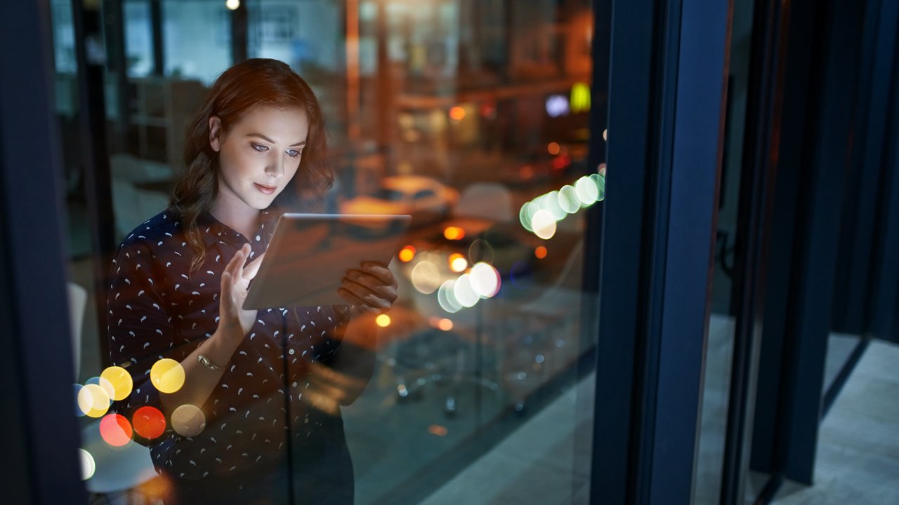 How climate risk is shaping real estate strategy Cropped shot of a young businesswoman working late on a digital tablet in an office