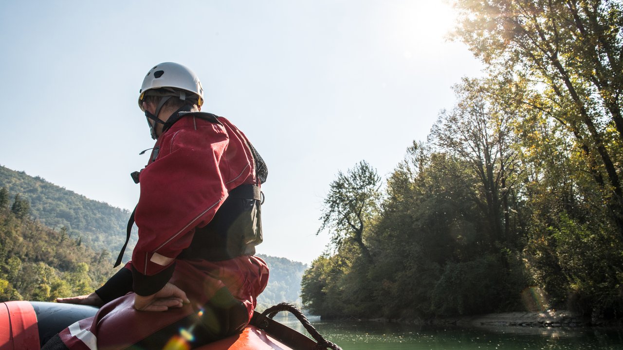Rescue worker on a rubber boat on a river