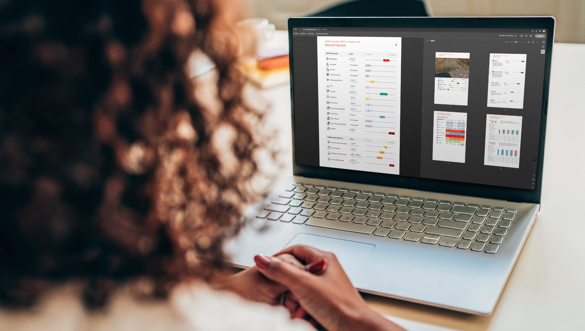Businesswoman looking at research data on laptop